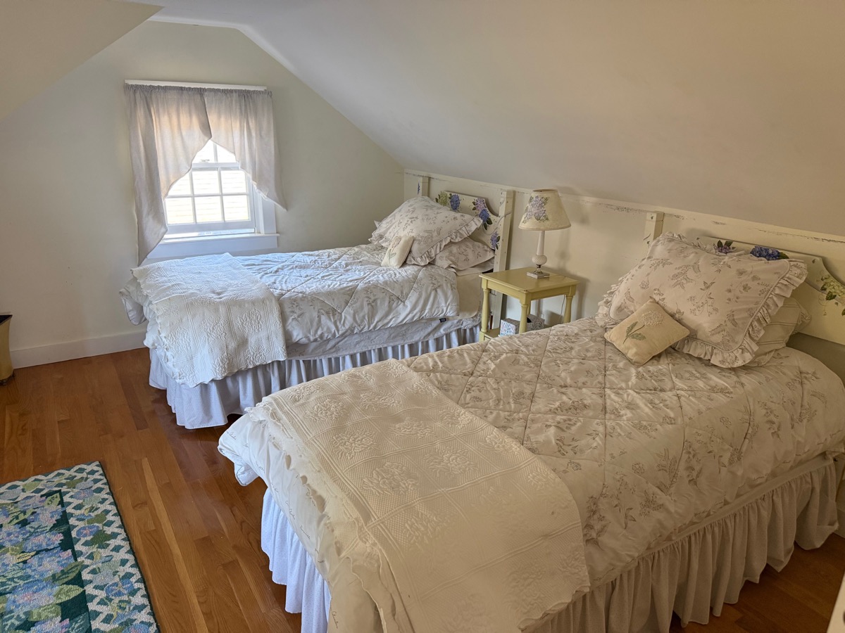 Upstairs bedroom with two beds